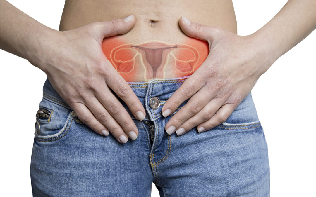 Hands cradle the lower abdomen over jeans with a glowing red illustration of the uterus and ovaries inside, suggesting pelvic pain or gynecological focus.