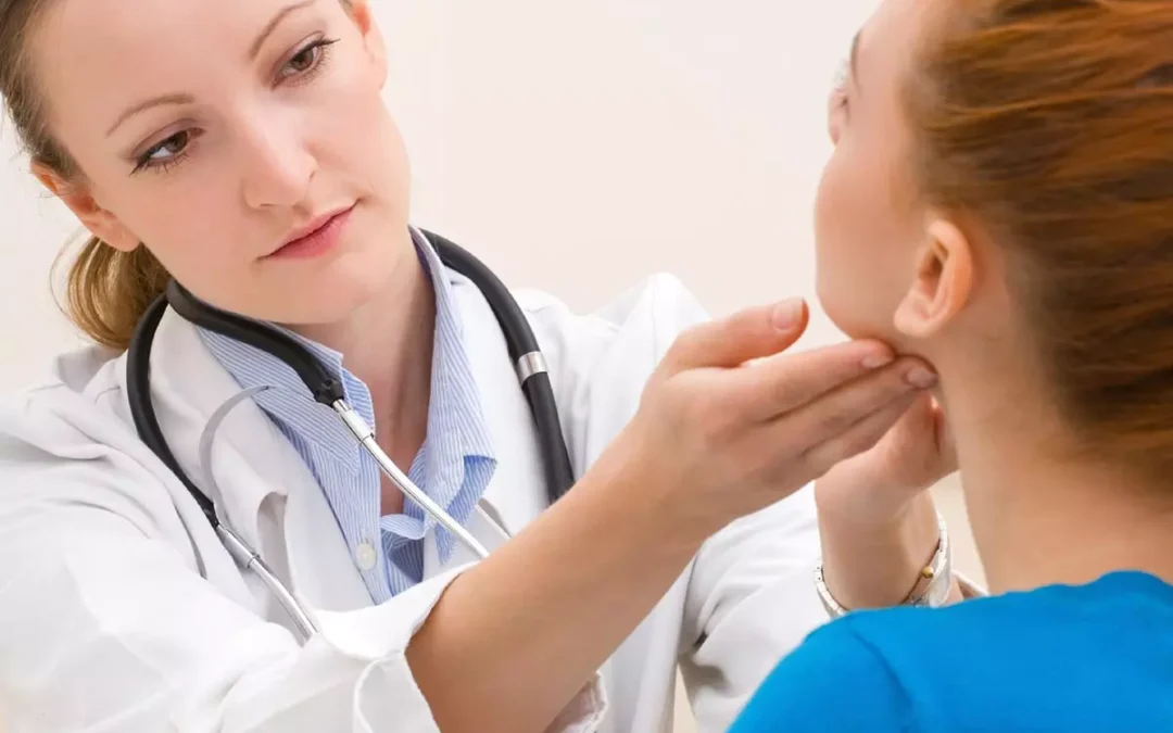 Teenage patient at follow up appointment for thyroid cancer recovery